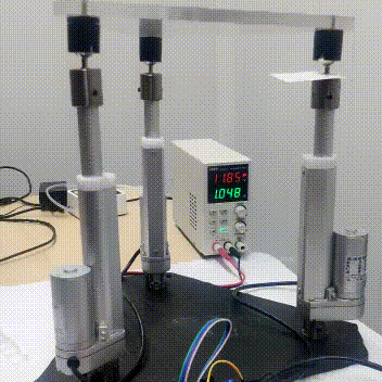 Gif of parallel robot platform and voltage source in background